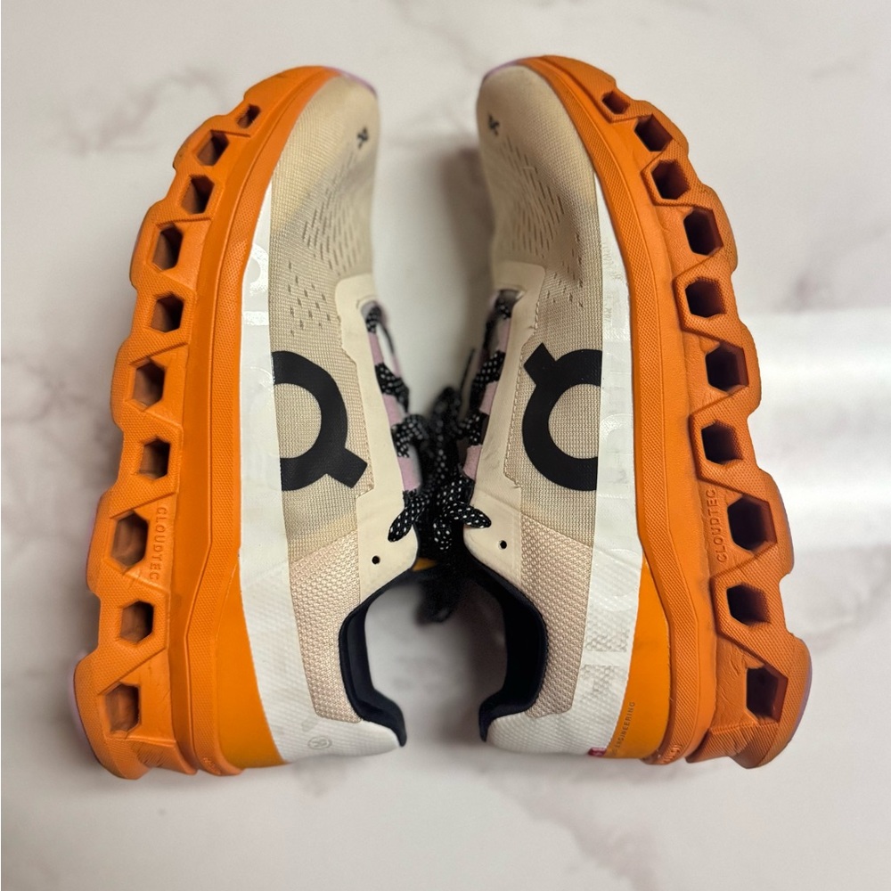 On Running Athletic Shoes in Orange and Cream